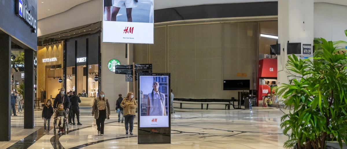 Modern digital signage Dubai display in Dubai showcasing dynamic advertisements on a high-resolution LED screen in a busy urban setting