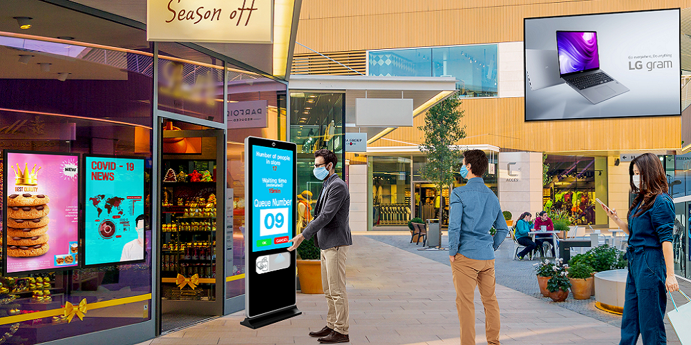 A modern outdoor signage installation in Abu Dhabi featuring illuminated brand logos and sleek design.