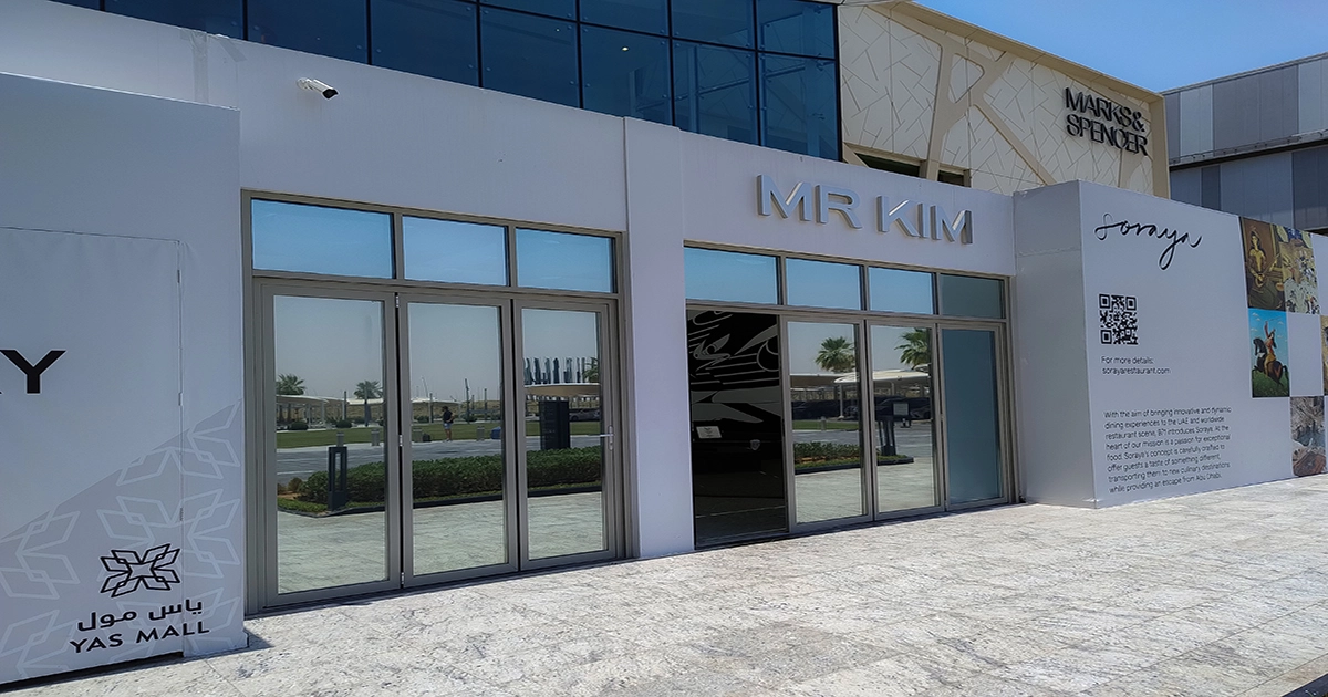 A modern outdoor signage installation in Abu Dhabi featuring illuminated brand logos and sleek design