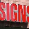 A high-quality sign board Dubai displaying a custom business logo with vibrant colors and clear typography.